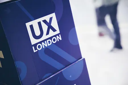 A stack of boxes that reads: UX London.